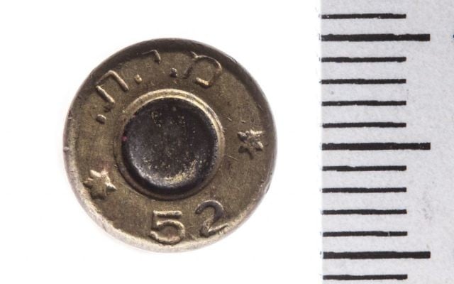 The Temple Mount Sifting Project uncovered this 9 mm casing, manufactured in 1952, with the Hebrew letters 'MIT,' which is an acronym for the State of Israel, Military Industry (Tal Rogovski)