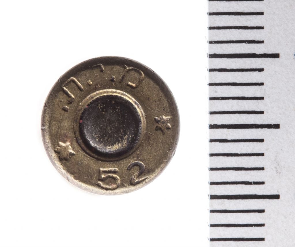 The Temple Mount Sifting Project uncovered this 9 mm casing, manufactured in 1952, with the Hebrew letters 'MIT,' which is an acronym for the State of Israel, Military Industry (Tal Rogovski) The Temple Mount Sifting Project uncovered this 9 mm casing, manufactured in 1952, with the Hebrew letters 'MIT,' which is an acronym for the State of Israel, Military Industry (Tal Rogovski)