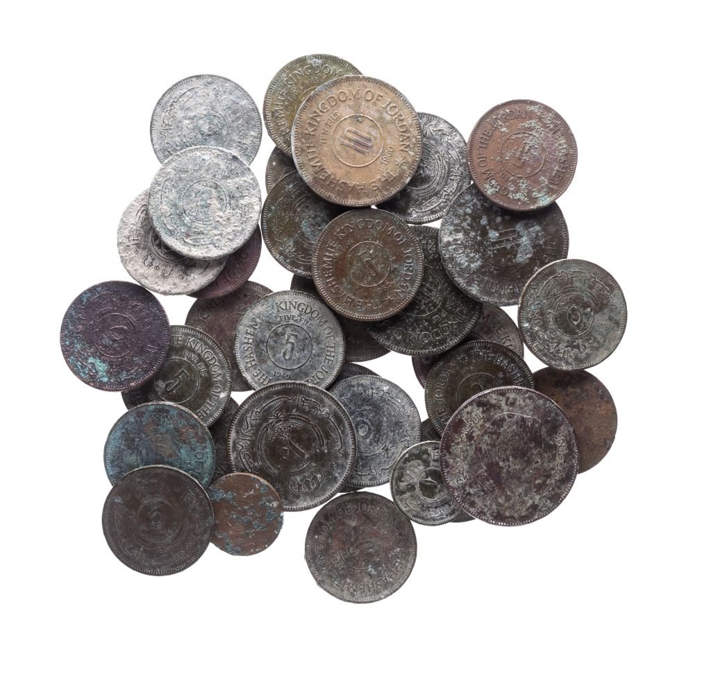 Jordanian Hashemite Kingdom coins, dated 1948-1967, and a coin dated to 1991 with the portrait of King Hussain, collected by the Temple Mount Sifting Project. (Tal Rogovski) Jordanian Hashemite Kingdom coins, dated 1948-1967, and a coin dated to 1991 with the portrait of King Hussain, collected by the Temple Mount Sifting Project. (Tal Rogovski)