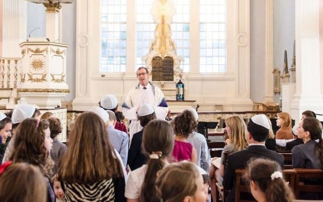 Rabbi Darren Levine leading a youth service at Tamid Downtown Synagogue in New York. (Courtesy)