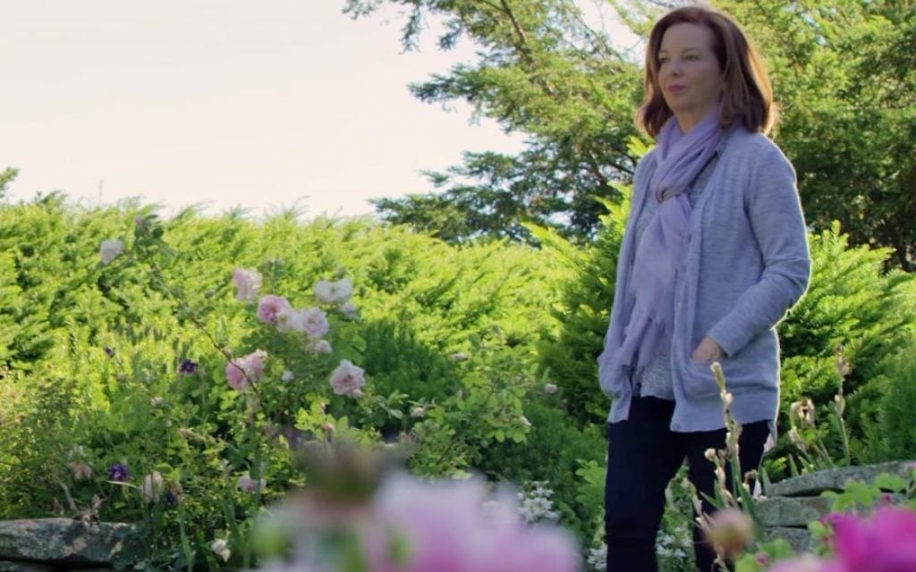 Author Martha Hall Kelly in the garden which inspired her book, 'Lilac Girls.' (YouTube screenshot)