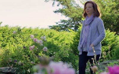 Author Martha Hall Kelly in the garden which inspired her book, 'Lilac Girls.' (YouTube screenshot)