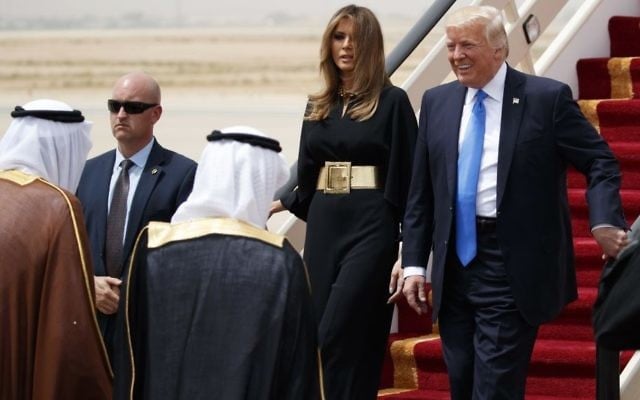 US President Donald Trump, accompanied by first lady Melania Trump, smiles at Saudi King Salman, left, upon his arrival at a welcome ceremony at the Royal Terminal of King Khalid International Airport, Saturday, May 20, 2017, in Riyadh. (AP Photo/Evan Vucci) US President Donald Trump, accompanied by first lady Melania Trump, smiles at Saudi King Salman, left, upon his arrival at a welcome ceremony at the Royal Terminal of King Khalid International Airport, Saturday, May 20, 2017, in Riyadh. (AP Photo/Evan Vucci)
