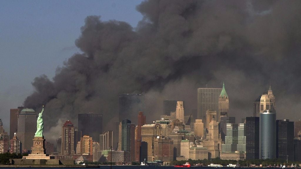 In this Sept. 11, 2001 file photo, thick smoke billows into the sky from the area behind the Statue of Liberty, lower left, where the World Trade Center towers stood. (AP Photo/Daniel Hulshizer) In this Sept. 11, 2001 file photo, thick smoke billows into the sky from the area behind the Statue of Liberty, lower left, where the World Trade Center towers stood. (AP Photo/Daniel Hulshizer)