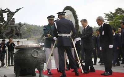 New South Korea's President Moon Jae-in, second right on red carpet, offers a wreath at the National Cemetery in Seoul, South Korea Wednesday, May 10, 2017. (Kim Hong-ji/AP)