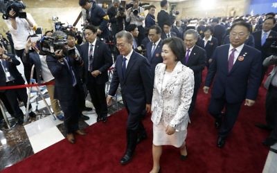 Newly elected South Korean President Moon Jae-in, center left, and his wife Kim Jung-suk leave after his inauguration ceremony at the National Assembly in Seoul, South Korea, Wednesday, May 10, 2017 (AP/Ahn Young-joon)