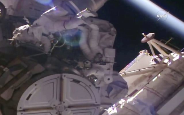 In this NASA provided frame from video, NASA astronauts Peggy Whitson, left, and Jack Fischer go out on a spacewalk to make repairs outside the International Space Station on Tuesday, May 23, 2017. (NASA via AP)