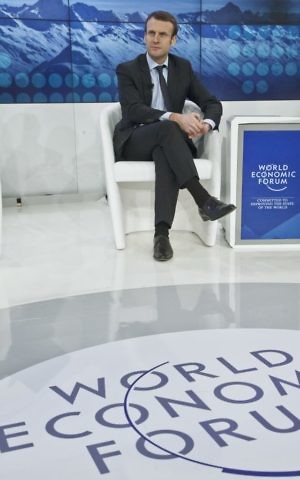 FILE - In this file photo dated Friday, Jan. 22, 2016, France's Economy Minister Emmanuel Macron attends a TV debate "Europe at a Tipping Point" at the World Economic Forum in Davos, Switzerland. (Michel Euler/AP) 