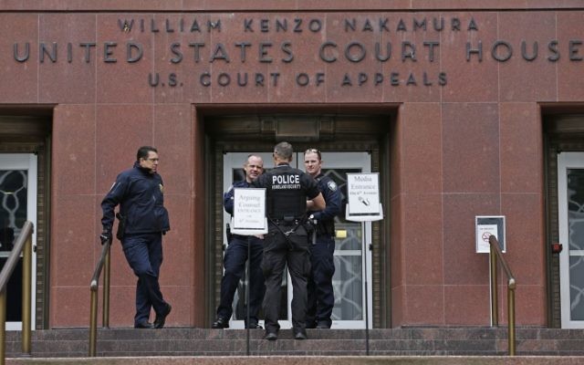 Law enforcement officials stand outside a federal courthouse in Seattle, as a three-judge panel of the 9th US Circuit Court of Appeals hears arguments inside over Hawaii's lawsuit challenging President Donald Trump's revised travel ban, May 15, 2017. (AP/Ted S. Warren) Law enforcement officials stand outside a federal courthouse in Seattle, as a three-judge panel of the 9th US Circuit Court of Appeals hears arguments inside over Hawaii's lawsuit challenging President Donald Trump's revised travel ban, May 15, 2017. (AP/Ted S. Warren)