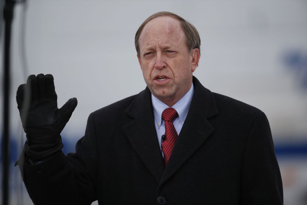 In this Nov. 29, 2015, file photo, Colorado Springs, Colo., Mayor John Suthers talks to a reporter as police investigators gather evidence near the scene of Friday's shooting at a Planned Parenthood clinic. (AP/David Zalubowski, File) In this Nov. 29, 2015, file photo, Colorado Springs, Colo., Mayor John Suthers talks to a reporter as police investigators gather evidence near the scene of Friday's shooting at a Planned Parenthood clinic. (AP/David Zalubowski, File)