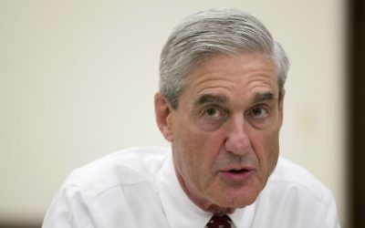 In this Aug. 21, 2013, file photo, then-FBI director Robert Mueller speaks during an interview at FBI headquarters in Washington. (AP Photo/Evan Vucci, File)