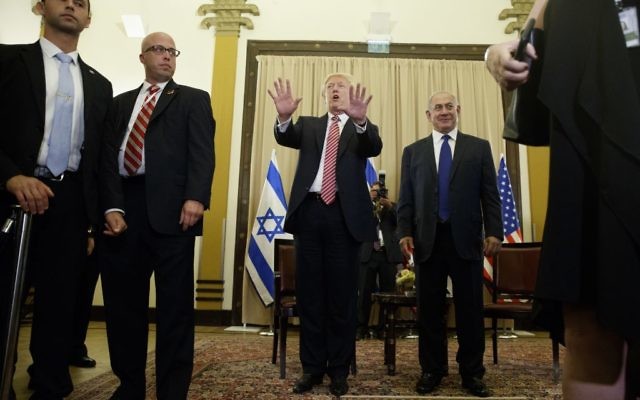 US President Donald Trump, center, talks to reporters before a meeting with Prime Minister Benjamin Netanyahu, right, at the King David Hotel, in Jerusalem May 22, 2017. (AP/Evan Vucci) 