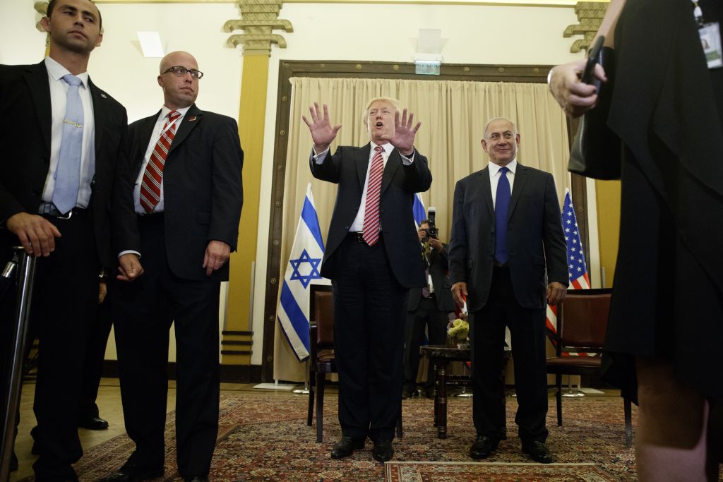 US President Donald Trump, center, talks to reporters before a meeting with Prime Minister Benjamin Netanyahu, right, at the King David Hotel, in Jerusalem May 22, 2017. (AP/Evan Vucci) US President Donald Trump, center, talks to reporters before a meeting with Prime Minister Benjamin Netanyahu, right, at the King David Hotel, in Jerusalem May 22, 2017. (AP/Evan Vucci)