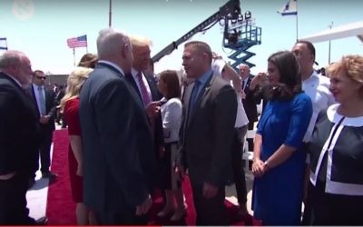 Prime Minister Benjamin Netanyahu, center left, US President Donald Trump, center, and Internal Security Minister Gilad Erdan, center right, on the tarmac at Ben Gurion Airport, May 22, 2017. (Screen capture, YouTube/Haaretz)