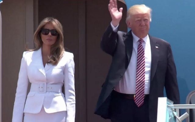 US President Donald Trump, flanked by his wife, Melania, emerges from Air Force One after landing in Israel (screen capture: GPO)