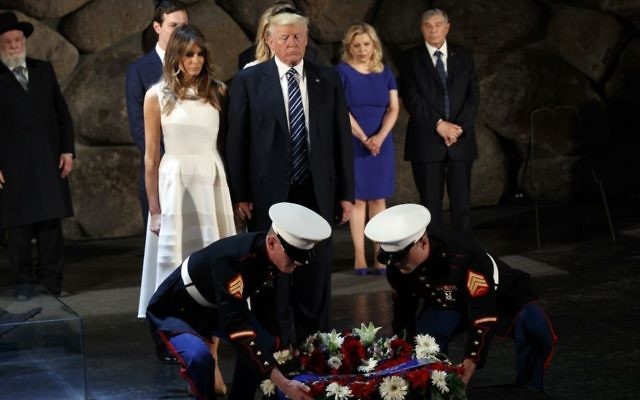 US President Donald Trump, center, and first lady Melania Trump, center left, lay a wreath at Yad Vashem to honor the victims of the holocaust in Jerusalem, May 23, 2017. (AP/Evan Vucci) 