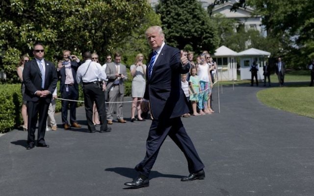 President Donald Trump gives a 'thumbs-up' as he walks back into the White House in Washington, Wednesday, May 17, 2017, following his short trip on Marine One from nearby Andrews Air Force Base, Md. (AP/Pablo Martinez Monsivais) President Donald Trump gives a 'thumbs-up' as he walks back into the White House in Washington, Wednesday, May 17, 2017, following his short trip on Marine One from nearby Andrews Air Force Base, Md. (AP/Pablo Martinez Monsivais)