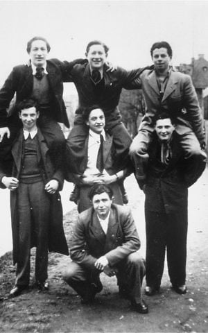 A group of Jewish DPs pose on one anothers' shoulders in the Landberg displaced persons camp. Among those pictured are Solly Ganor (center), David Granot (on Solly's shoulders) and David Levine (top, left). (Courtesy USHMM/Eric Saul) A group of Jewish DPs pose on shoulders in the Landberg displaced persons camp. (Courtesy USHMM/Eric Saul)