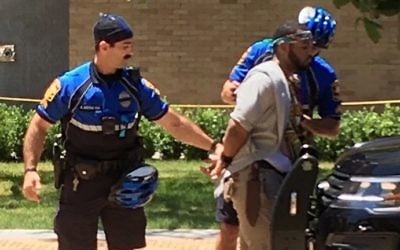 A man is arrested after a fatal stabbing attack on the University of Texas campus in Austin, Texas, on May 1, 2017. (Ray Arredondo via AP)