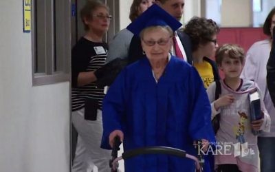 Holocaust survivor Esther Begam in her high school graduation gown (screen capture: Kare 11)