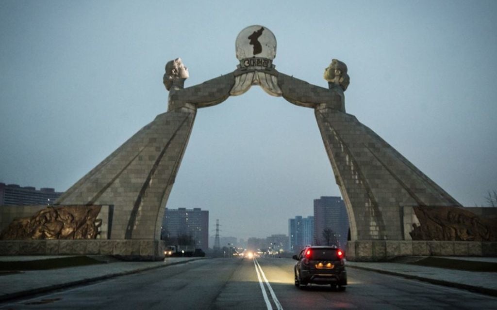 The Arch of Reunification straddles the Reunification Highway, which connects Pyongyang with the DMZ. The two women symbolize North and South Korea. (Moshe Shai)
