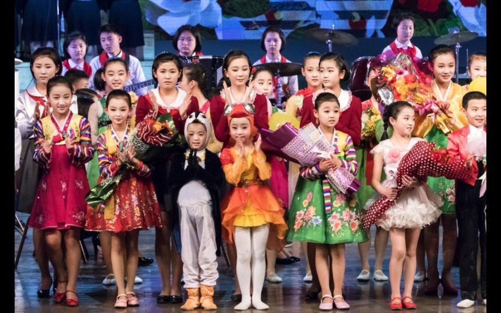 Costumed children perform in North Korea. The government wants tourists to visit the country for income, Shai said. (Moshe Shai)