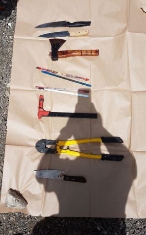 Weapons that police said were used by a Jerusalem couple to murder Shlomo Sami Marciano. (Police spokesperson)