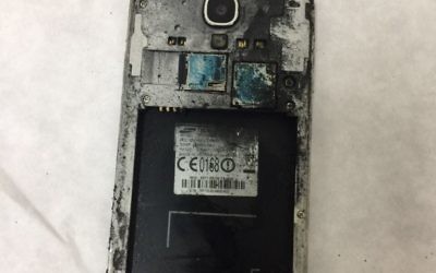 A burned Samsung cell phone suspected of combusting, injuring a boy. (David Zlotnick)