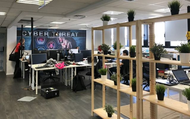 Desks and hackers at White-Hat offices in Tel Aviv (Shoshanna Solomon/TimesofIsrael)