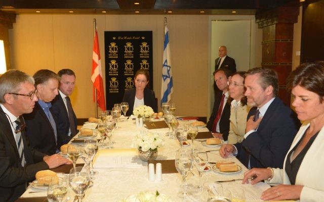 Anders Samuelsen, Denmark's Minister for Foreign Affairs, at the right side of the table and second from right, meets with representatives of Israeli high tech industry in Jerusalem. He is faced by Danish Ambassador to Israel, Jesper Vahr, and flanked to his left by incoming Ambassador to Israel Charlotte Slente (Courtsy: Yossi Zwecker)