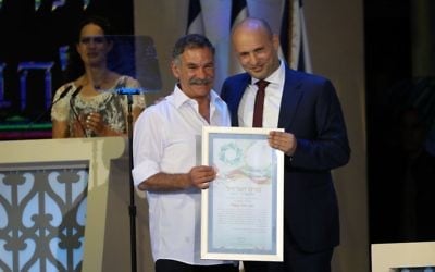 Education Minister Naftali Bennett with Israel Prize winner David Beeri during the Israel prize ceremony at the International Conference Center (ICC) in Jerusalem, May 2, 2017. Photo by Yonatan Sindel/Flash90