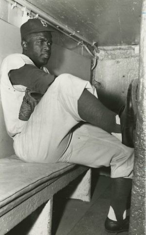 Jackie Robinson in dugout, circa 1950. (Brooklyn Historical Society)