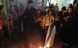 Ultra-orthodox Jews in the Jerusalem neighborhood of Mea Shearim burn an Israeli flag at the end of the country‘s 69th Independence Day, May 2, 2017. (Channel 10 screenshot.)