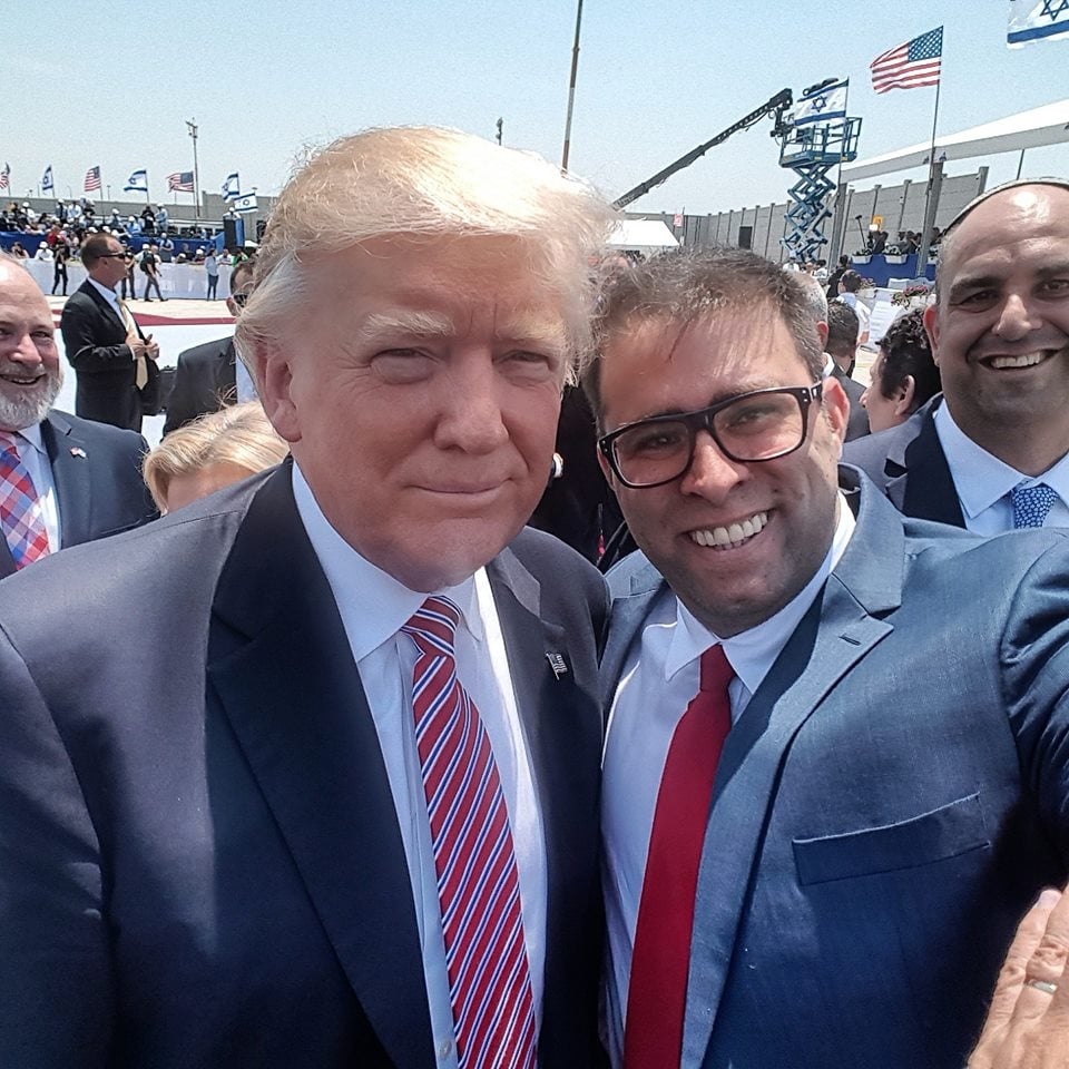 US President Donald Trump poses for a selfie with MK Oren Hazan at Ben Gurion Airport on Monday, May 22, 2017. Prime Minister Benjamin Netanyahu's hand can be seen in the lower right-hand corner, in a failed attempt to deflect Hazan's arm. (Oren Hazan) US President Donald Trump poses for a selfie with MK Oren Hazan at Ben Gurion Airport on Monday, May 22, 2017. Prime Minister Benjamin Netanyahu's hand can be seen in the lower right-hand corner, in a failed attempt to deflect Hazan's arm. (Oren Hazan)