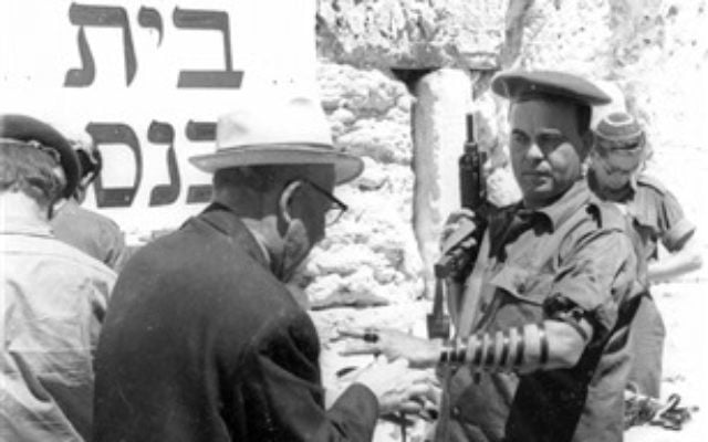 A soldier lays Tefillin at the Western Wall, June 11, 1967. (From the collection of Dan Hadani, National Library of Israel). A soldier lays Tefillin at the Western Wall, June 11, 1967. (From the collection of Dan Hadani, National Library of Israel).