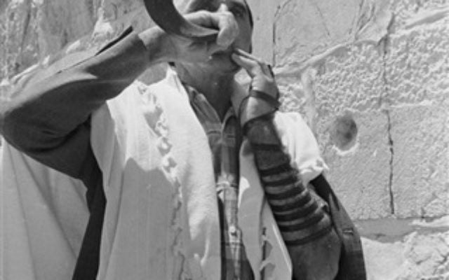 A man blows the ram's horn shofar at the Western Wall, June 22, 1967. (From the collection of Dan Hadani, National Library of Israel). A man blows the ram's horn shofar at the Western Wall, June 22, 1967. (From the collection of Dan Hadani, National Library of Israel).