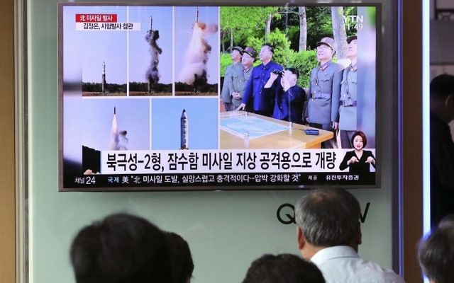 People watch a TV news program showing images of North Korean leader Kim Jong Un and the missile launch, published in the North Korea's Rodong Sinmun newspaper, at Seoul Railway station in Seoul, South Korea, Monday, May 22, 2017. (AP Photo/Lee Jin-man) People watch a TV news program showing images of North Korean leader Kim Jong Un and the missile launch, published in the North Korea's Rodong Sinmun newspaper, at Seoul Railway station in Seoul, South Korea, Monday, May 22, 2017. (AP Photo/Lee Jin-man)
