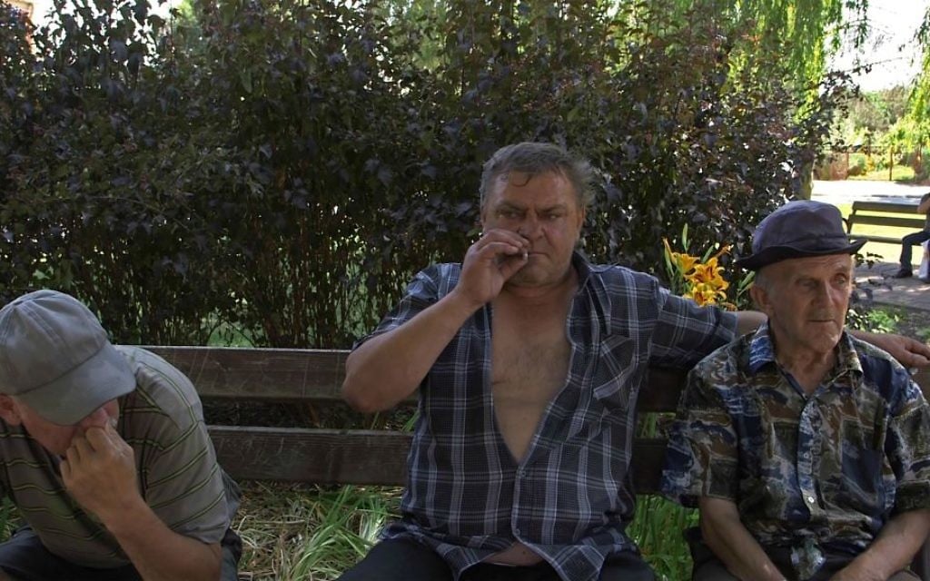 Men sit in village square in Iwaniska, Poland in 'Scandal in Ivansk' (Blumenfeld Pictures) Men sit in village square in Iwaniska, Poland in 'Scandal in Ivansk' (Blumenfeld Pictures)