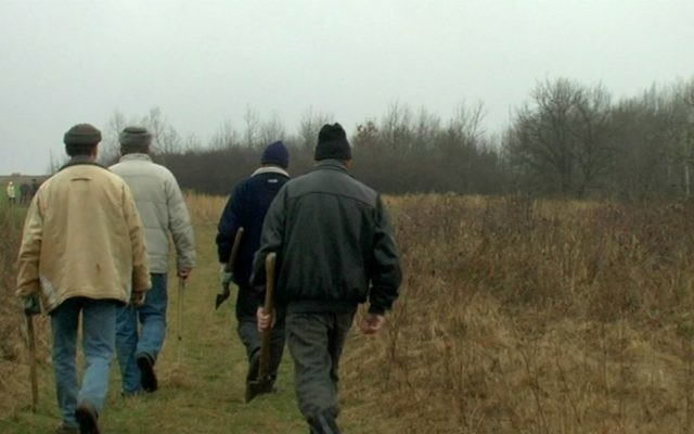 Local workers set off to clear six decades worth of brush growth at Jewish cemetery in Iwansika, Poland in 'Scandal in Ivansk.' (Blumenfeld Pictures)