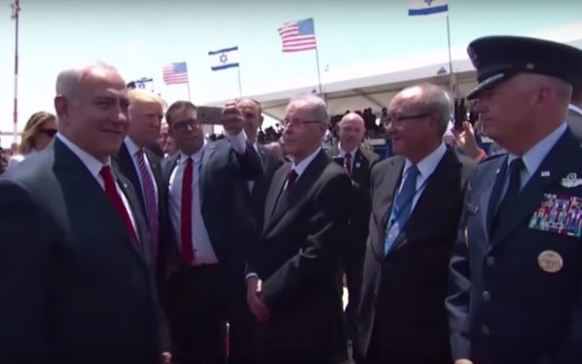 Likud lawmaker Oren Hazan (third from left) attempts a selfie photograph with US President Donald Trump (second from left) on the tarmac at Ben Gurion Airport, May 22, 2017. (YouTube screenshot)