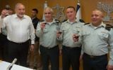 From left, Defense Minister Avigdor Liberman, outgoing IDF spokesperson Maj. Gen. Moti Almoz, incoming spokesperson Brig. Gen. Ronen Manelis and IDF Chief of Staff Lt. Gen. Gadi Eisenkot raise a toast at a ceremony in which Manelis officially entered his position,  at the army's Tel Aviv headquarters on May 18, 2017. (IDF Spokesperson's Unit)