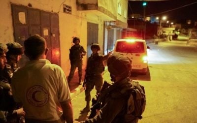 IDF arrests an ambulance driver, impounds his vehicle in the northern West Bank on May 19, 2017. The ambulance blocked the escape of an Israeli man who came under attack by a mob during a protest in the village of Hawara, outside Nablus. (IDF Spokesperson's Unit) IDF arrests an ambulance driver, impounds his vehicle in the northern West Bank on May 19, 2017. The ambulance blocked the escape of an Israeli man who came under attack by a mob during a protest in the village of Hawara, outside Nablus. (IDF Spokesperson's Unit)