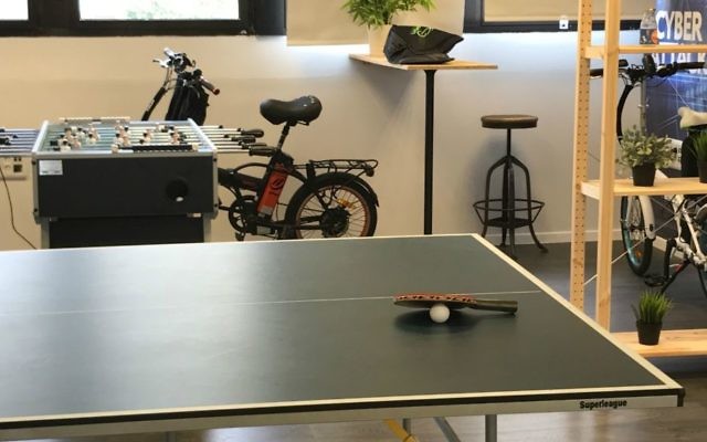 Ping-pong table, bikes in White-Hat's Tel Aviv offices (Shoshanna Solomon/TimesofIsrael)