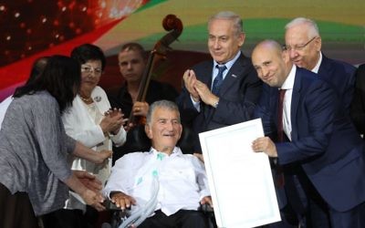Education Minister Naftali Bennett, Prime Minister Benjamin Netanyahu and President Reuven Rivlin with Zvi Levy, recipient of an Israel Prize for lifetime achievement, at the International Conference Center (ICC) in Jerusalem on May 2, 2017. Photo by Yonatan Sindel/Flash90