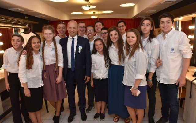 Sagiv Lugasi (c) winner of the annual Bible Quiz, with Prime Minister Benjamin Netanyahu (r) and Education Minister Naftali Bennett at the Jerusalem Theater, May 2, 2017 (Shlomi Amsalem) Sagiv Lugasi (c) winner of the annual Bible Quiz, with Prime Minister Benjamin Netanyahu (r) and Education Minister Naftali Bennett at the Jerusalem Theater, May 2, 2017 (Shlomi Amsalem)