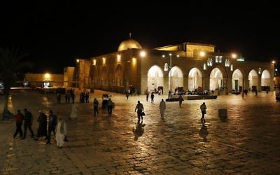 Palestinian men seen leaving the Al-Aqsa Mosque in the Old City of Jerusalem on May 29, 2017, during the Muslim holy month of Ramadan. (AFP Photo/Ahmad Gharabli)