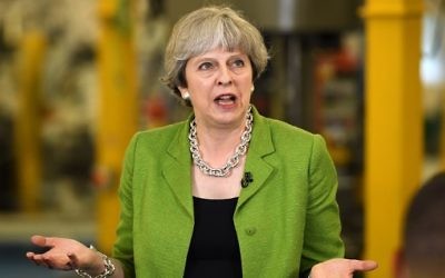Britain's Prime Minister Theresa May at a question and answer session during a general election campaign rally at Cross Manufacturing in Bath, south-west England, May 31, 2017. (AFP Photo/Pool/Leon Neal)