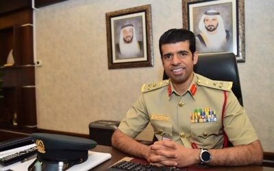 Brigadier Khaled al-Razzooqi, head of Smart Services at the Dubai police poses in his office in Dubai after giving an interview to AFP on May 31, 2017. (AFP Photo/Giuseppe Cacace)