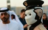 The world's first operational police robot stands to attention near the Burj Khalifa in downtown Dubai on May 31, 2017. (AFP Photo/Giuseppe Cacace)