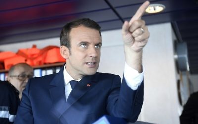 French President Emmanuel Macron gestures aboard the high seas emergency tow vessel "Abeille Bourbon", near Lorient on June 1, 2017. (AFP PHOTO / Damien MEYER)